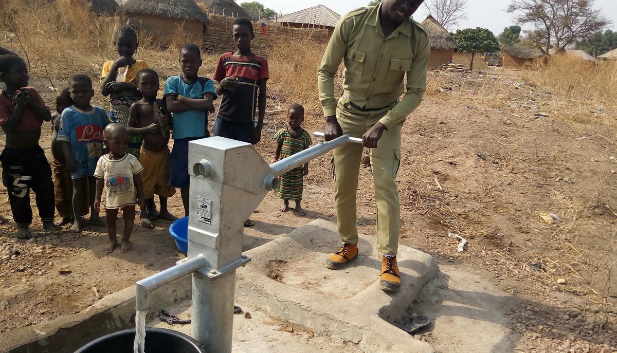 Project facilitator testing the borehole